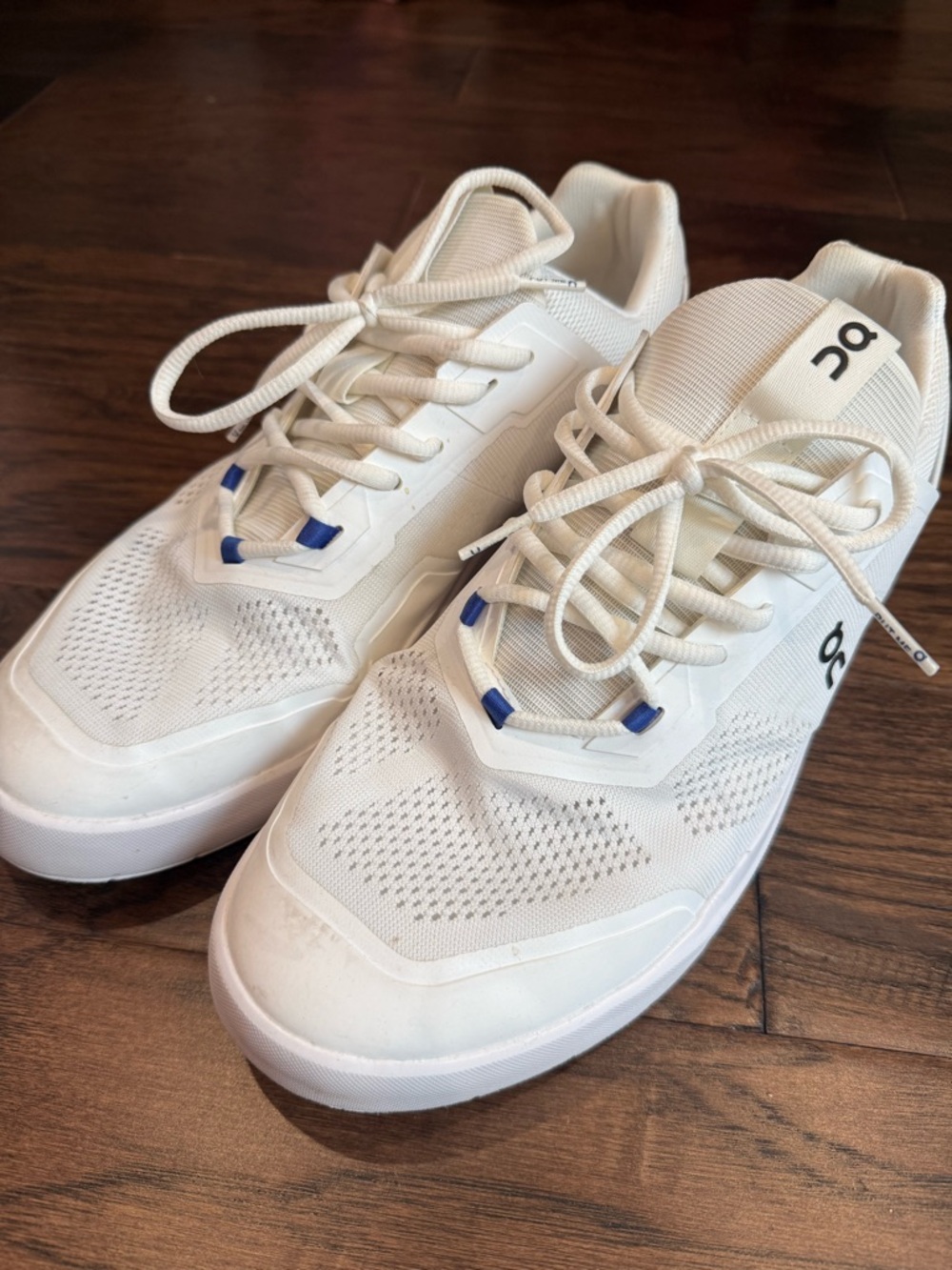 On Running Men’s White Sneakers with Blue Eyelets (The ROGER Spin 2)